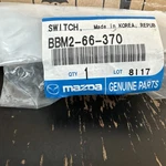 Genuine Mazda Window Switch BBM2-66-370. Fixed Price $15.00.